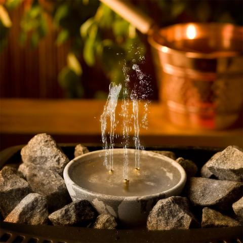 Hukka-Saunamaestro-Sauna-Fountain-on-stones